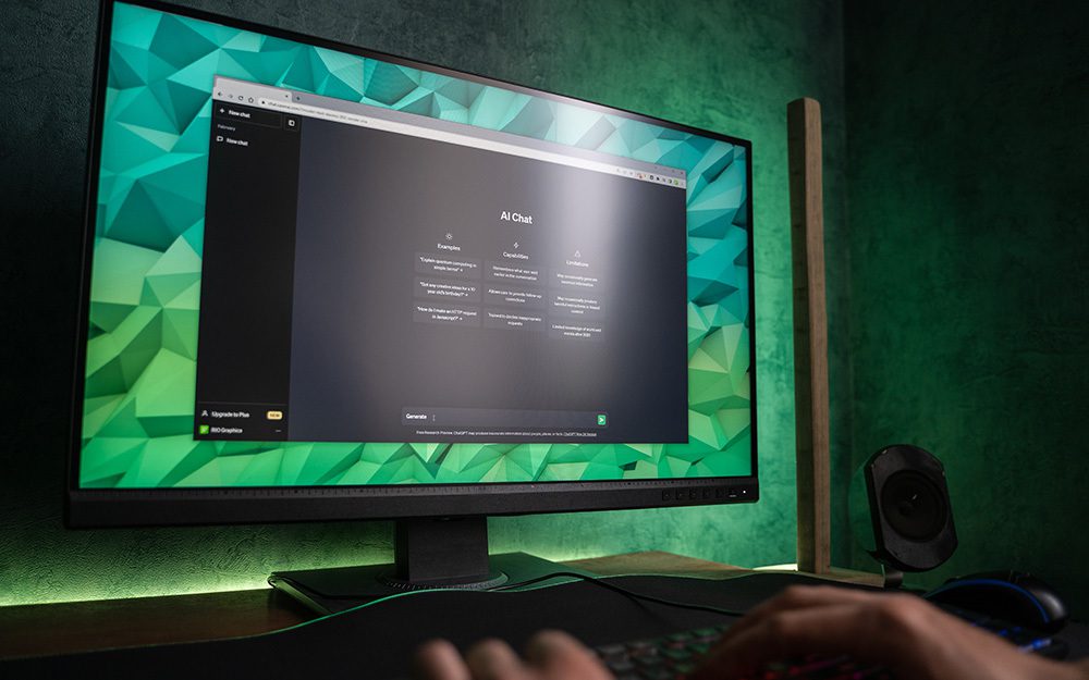 Image shows a desktop computer with ChatGPT open on the screen's browser.