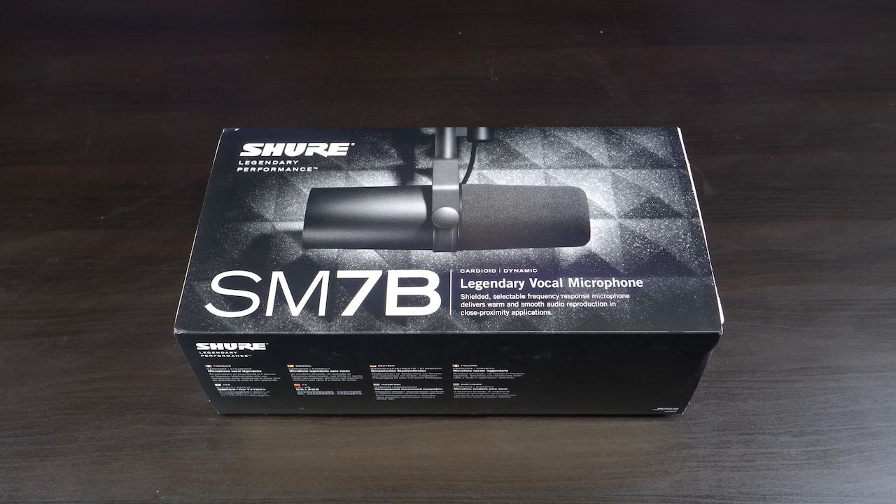 Image shows a Shure SM7B box on a desk.