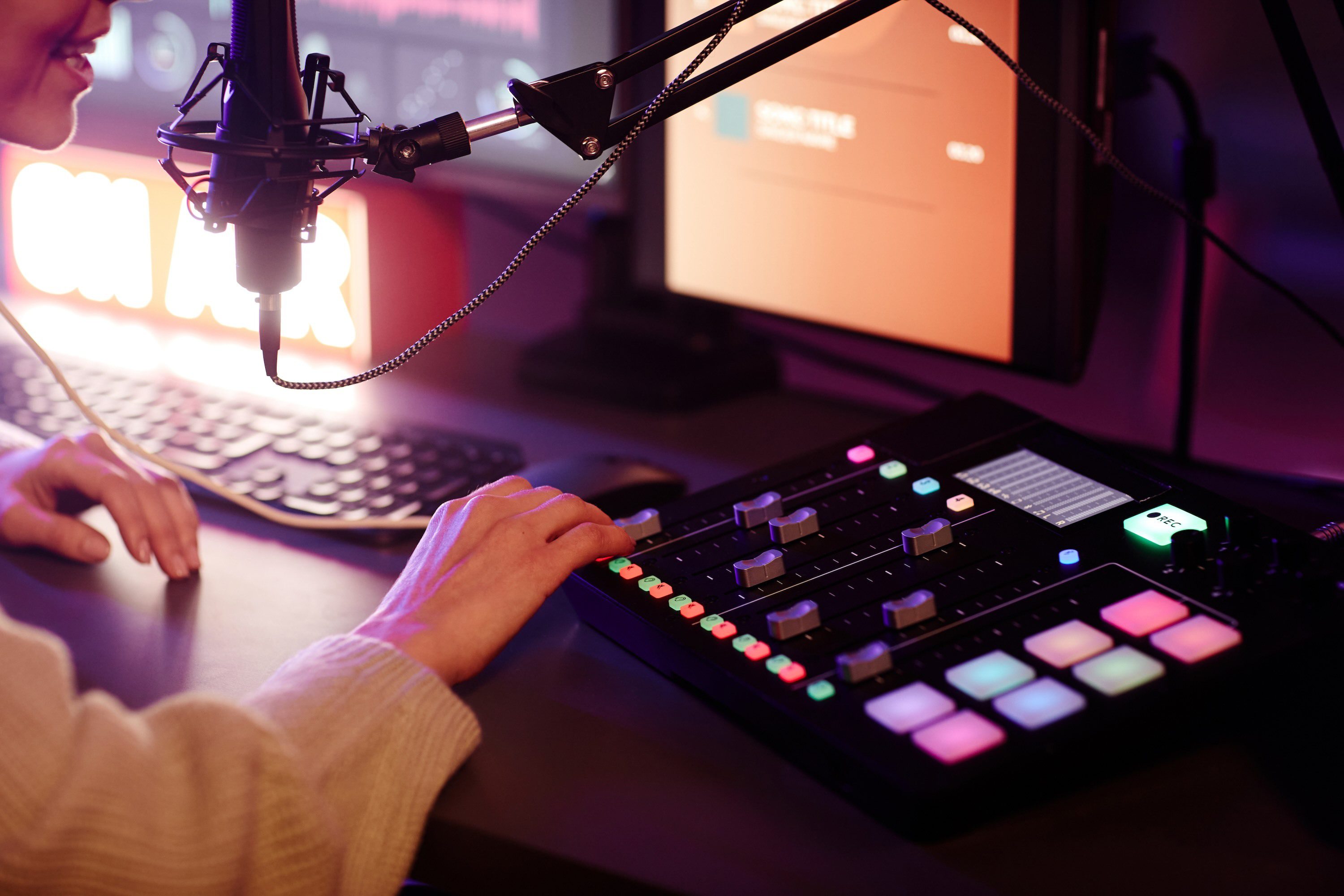 Close-Up Of Woman's Hands Adjusting Sound On Console Board