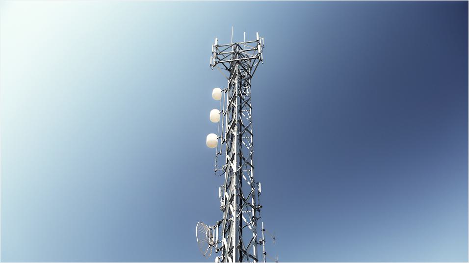 There is a plain blue sky backdrop, and in the centre of the image is a silver radio tower with white knobs visible.