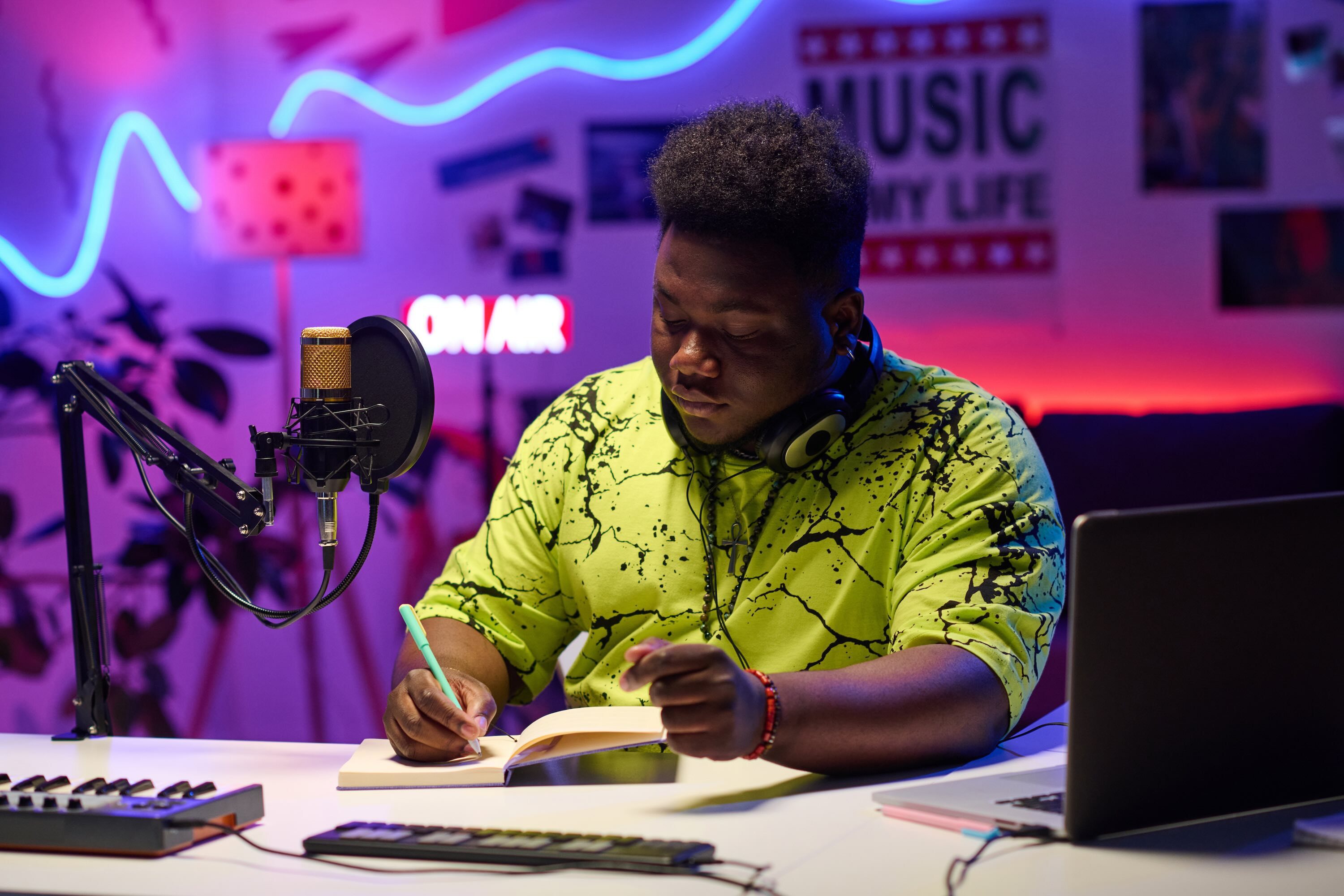 Man Sitting At His Workplace In Audio Studio