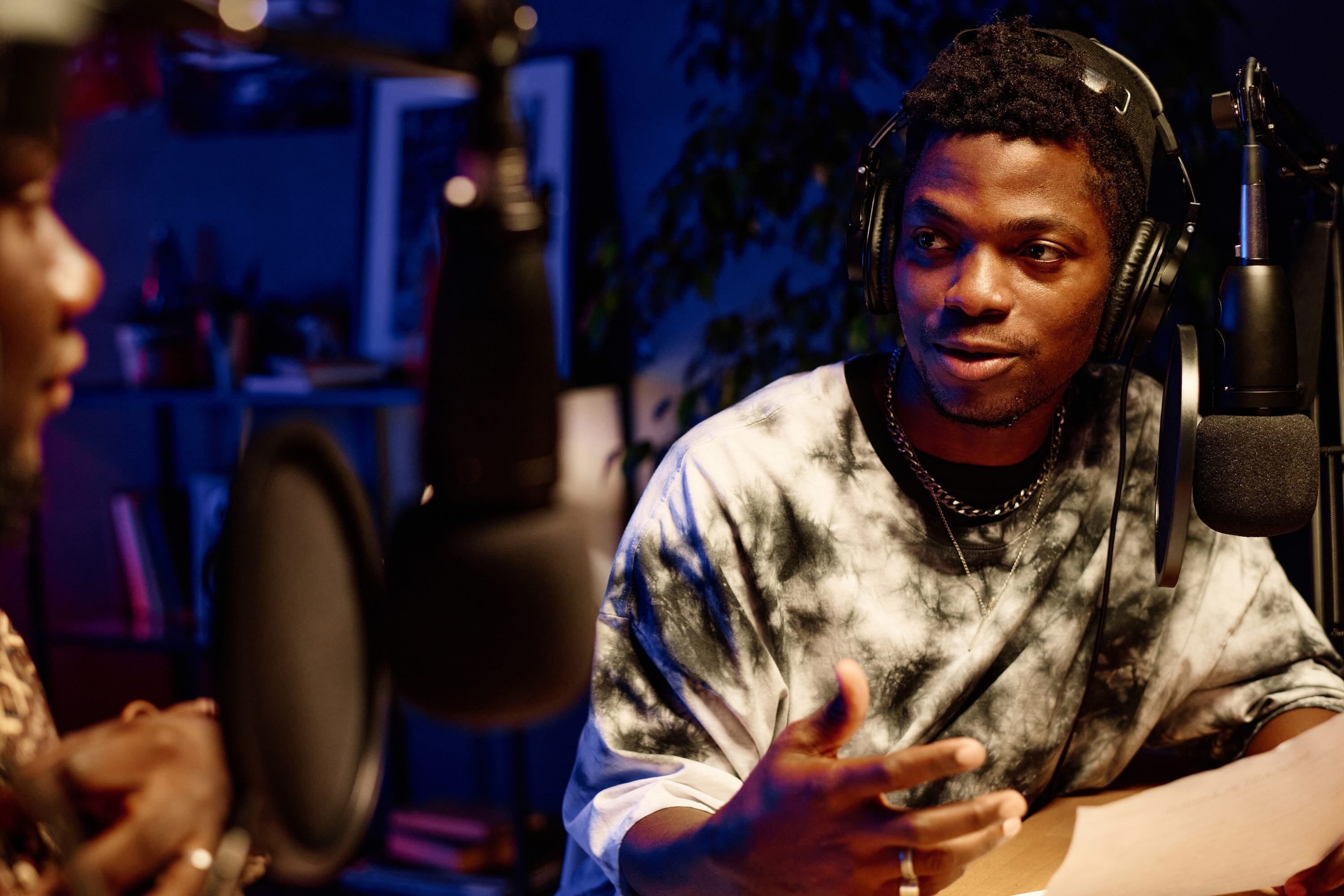 Man Talking Into A Microphone During Communication