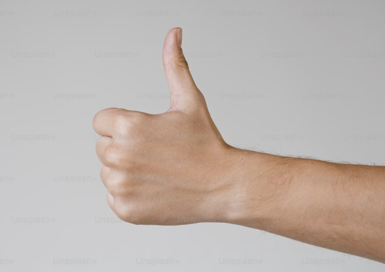 An outstretched hand in the centre of the image is giving a thumbs up sign.