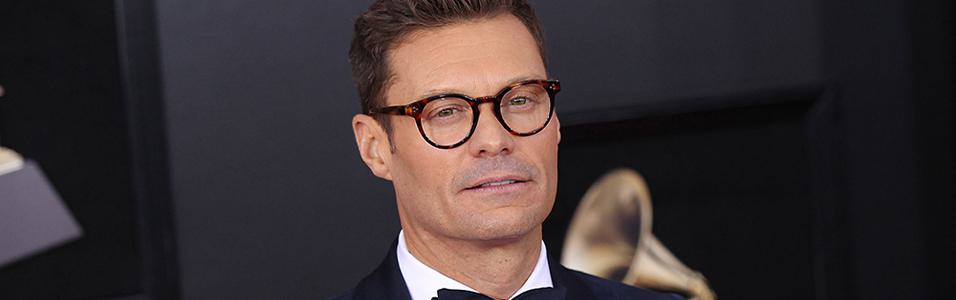 Image shows Ryan Seacrest at an awards ceremony.
