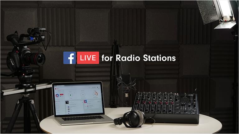 A plain studio with a lptop and a mixing desk next to it with some headphones. Above it is a captioned graphic: Facebook Live For Radio Stations.
