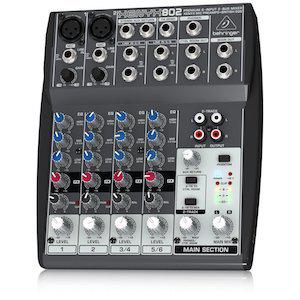 Image shows a Behringer XENYX 802 mixer against a white background.