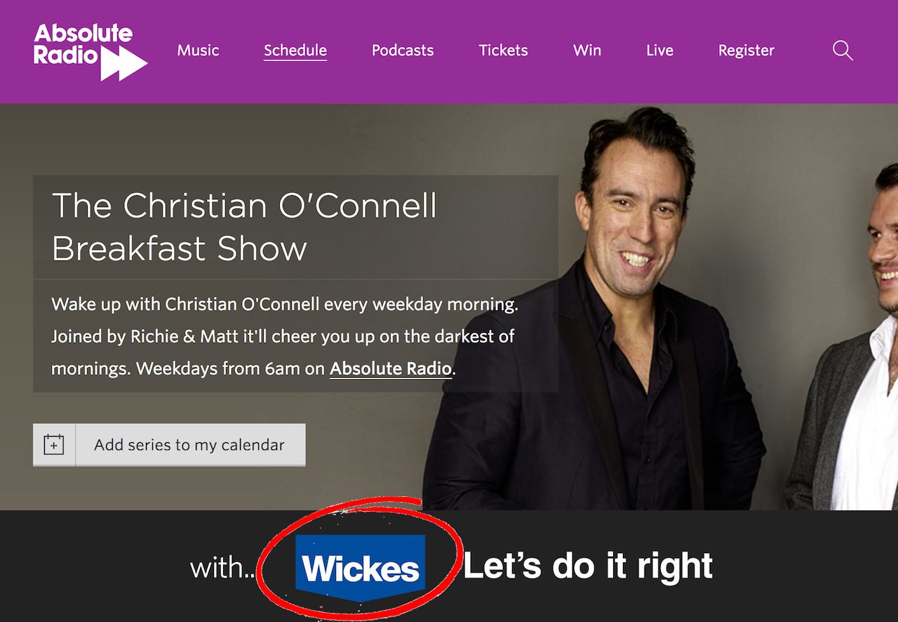 This is a screenshot of the Absolute Radio homepage. The top is purple, and the bottom is a black banner that reads "with...Wickes" with Wickes as a partnership circled in red.