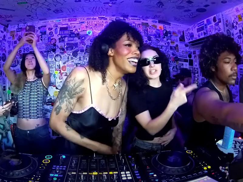 Image shows the DJ Archangel and Charli XCX broadcasting from The Lot Radio.