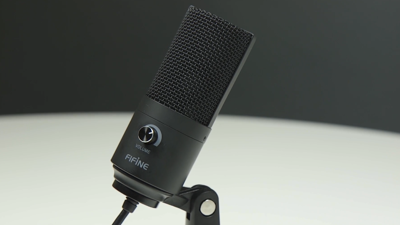 Image shows a black Fifine 669 mic attached to a desk stand.
