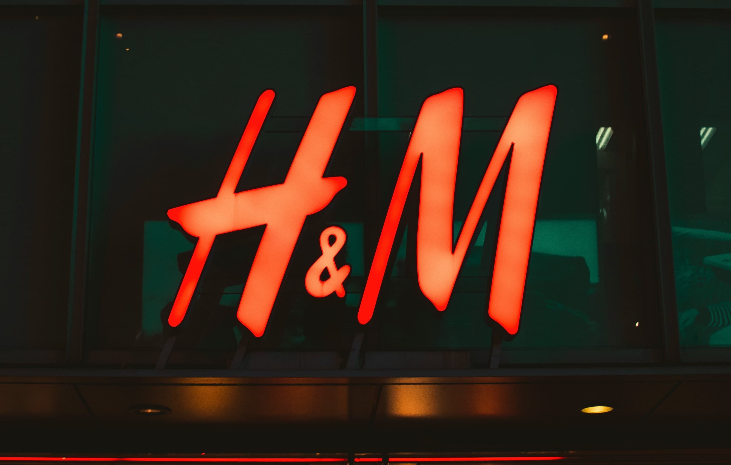 H&M light logo outside store window.