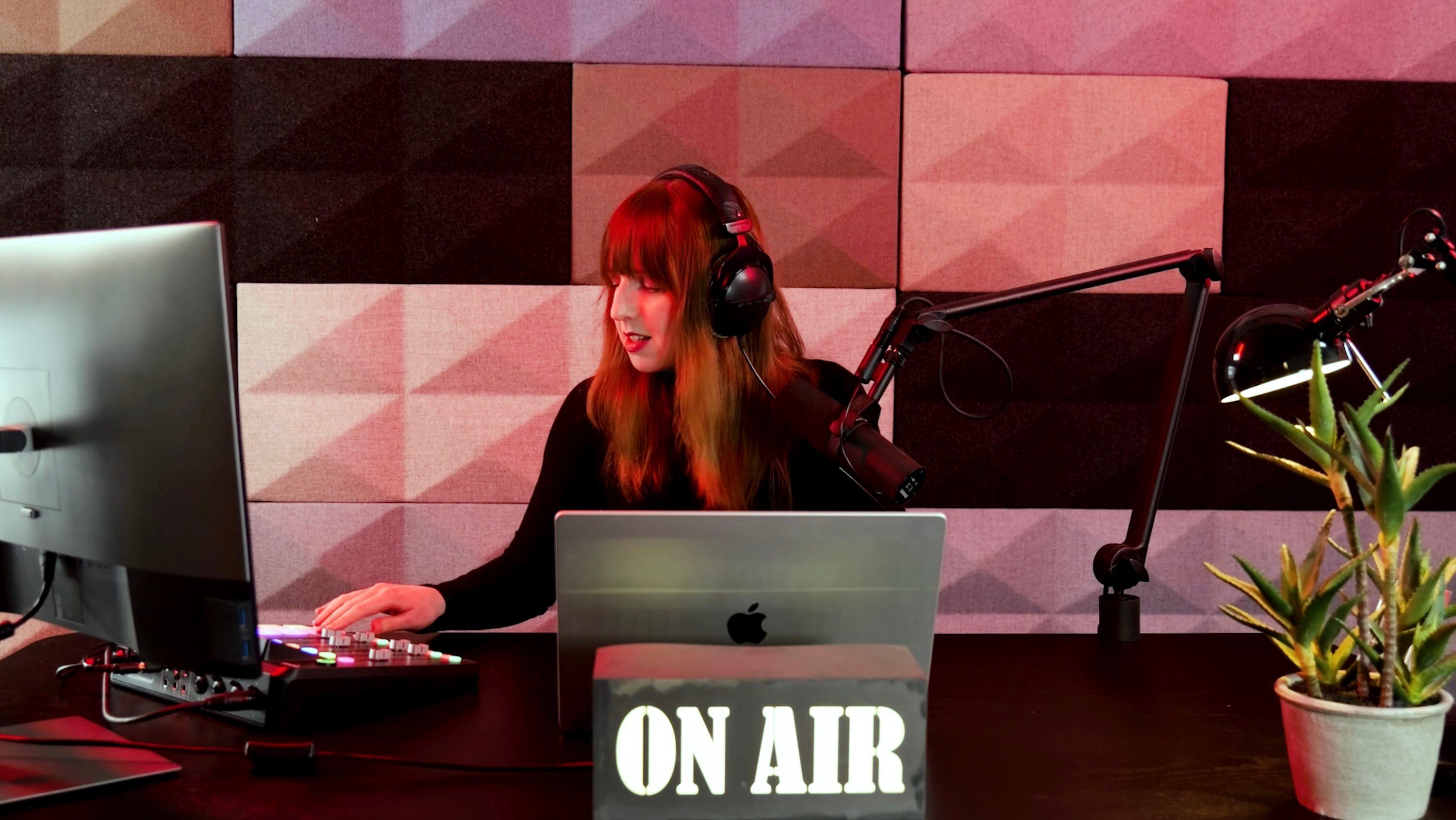 Woman broadcasting radio show in studio