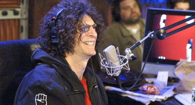 Image shows Howard Stern presenting his radio show.