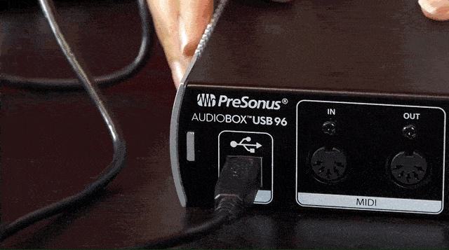 Image shows a USB cable plugged into an audio interface.