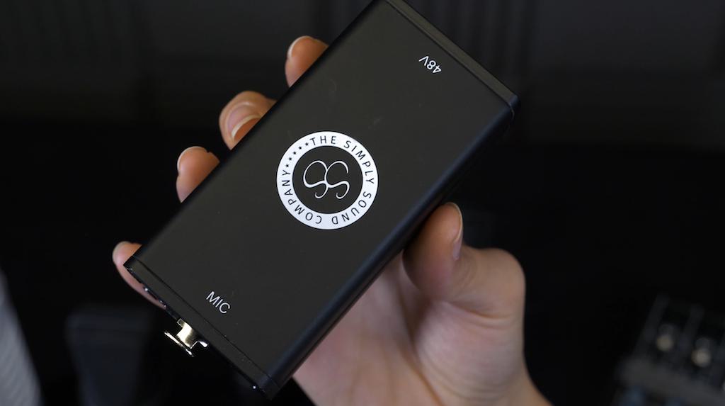 Image shows a hand holding the Simply Sound SS-1 preamp.