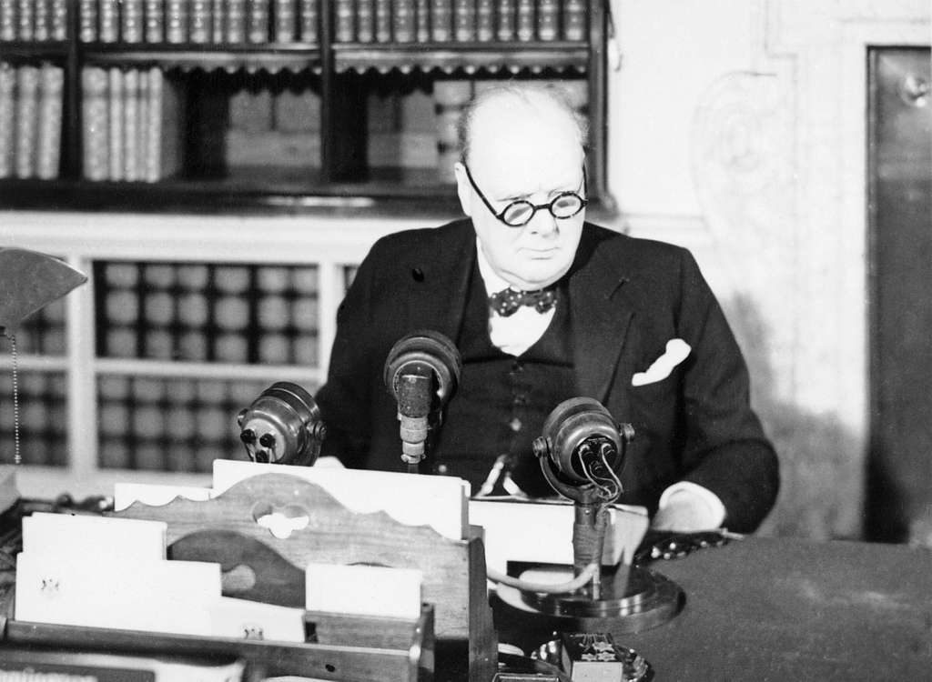 Winston Churchill at a BBC microphone about to broadcast to the nation on the afternoon of VE Day, 1945